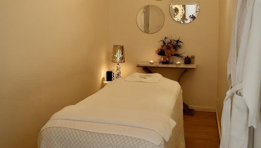 Relaxing spa room at Cheewa Aroma Remedial Thai, Melbourne, Victoria, AU. Featuring massage table and ambient decor.