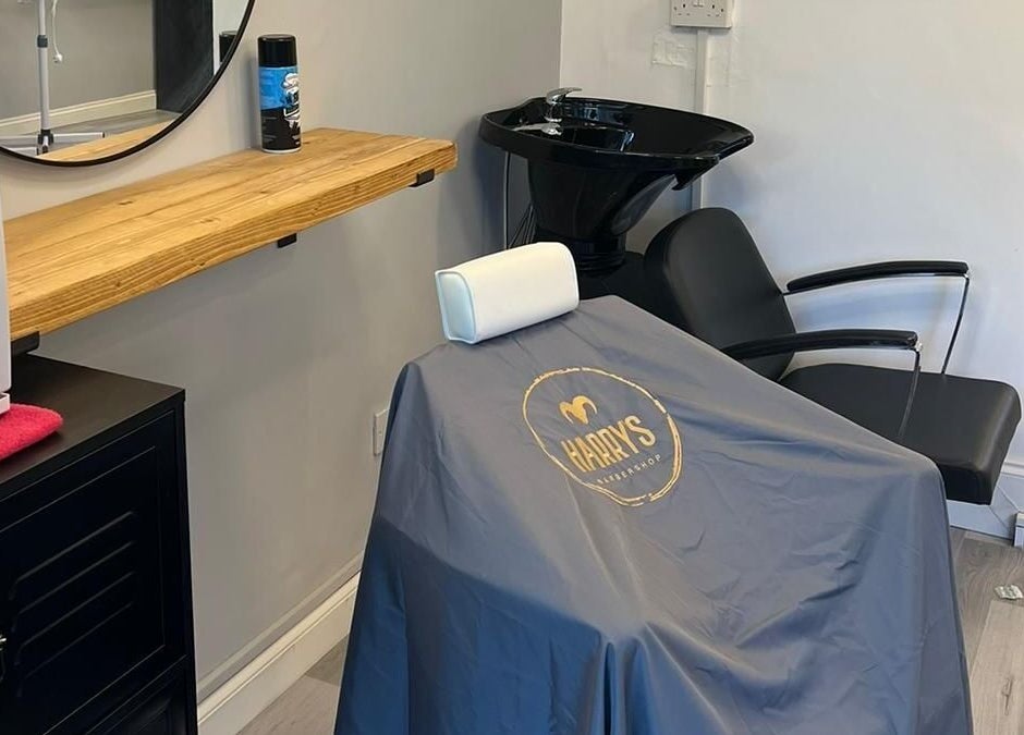 Modern chair setup at Harry’s Barbershop, Ramsbottom, England, GB, showcasing professional styling space.