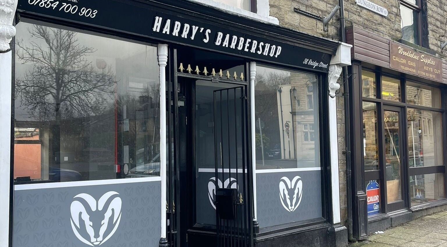 Entrance of Harry’s Barbershop located on Bridge Street, Ramsbottom, England, GB.