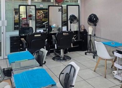 Inside Epiphany Salons SA in Randburg, Gauteng, ZA showcasing stylish salon stations and seating areas.
