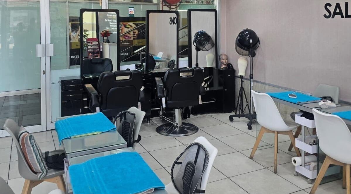 Inside Epiphany Salons SA in Randburg, Gauteng, ZA showcasing stylish salon stations and seating areas.