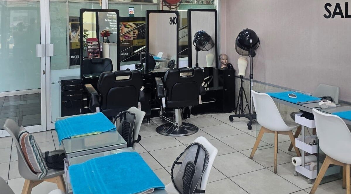 Inside Epiphany Salons SA in Randburg, Gauteng, ZA showcasing stylish salon stations and seating areas.