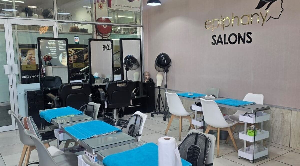 Epiphany Salons SA in Randburg, Gauteng, ZA boasts a chic interior with styling stations and modern decor.