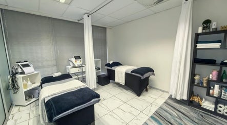Cozy treatment room at Mystique Aesthetics Century City, Cape Town, Western Cape, ZA with two massage beds.