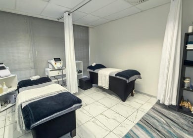 Relaxing treatment room at Mystique Aesthetics Century City, Cape Town, Western Cape, ZA with massage beds.