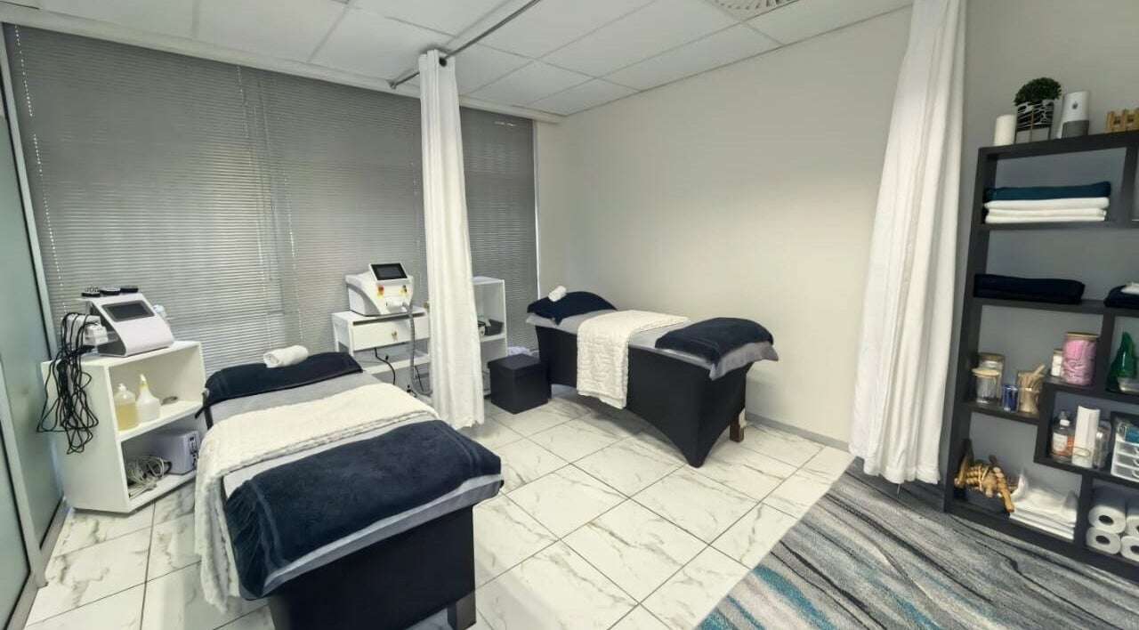 Relaxing treatment room at Mystique Aesthetics Century City, Cape Town, Western Cape, ZA with massage beds.