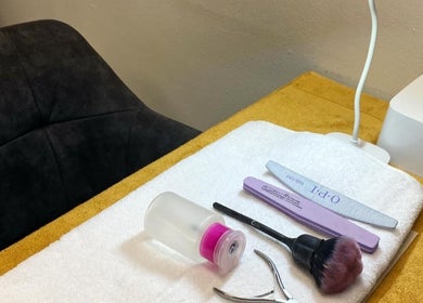 Nail care tools at Mystique Aesthetics Century City, Cape Town, Western Cape, ZA on a prepared treatment table.