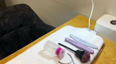 Nail care tools at Mystique Aesthetics Century City, Cape Town, Western Cape, ZA on a prepared treatment table.
