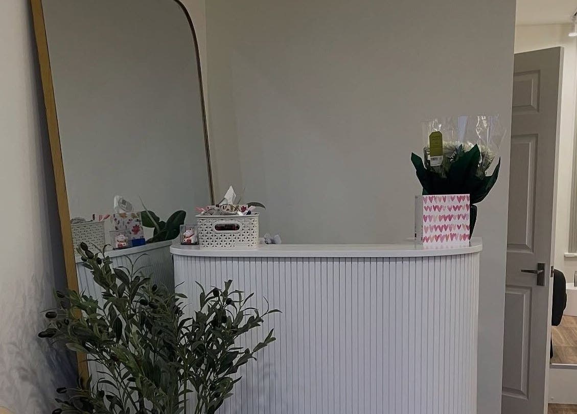 Welcoming reception area at The NailpodTw in Royal Tunbridge Wells, England, GB with chic decor and plants.