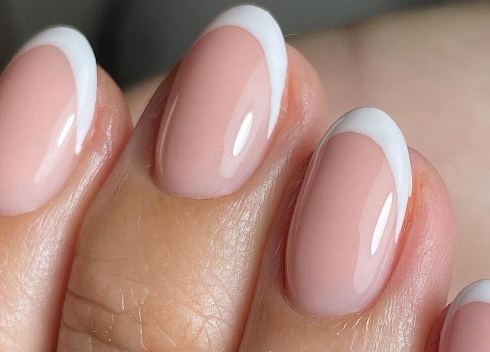 Fresh French manicure at The NailpodTw, Royal Tunbridge Wells, England, GB, showcasing clean white tips.