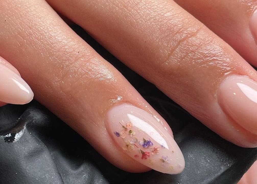 Elegant floral nail art at The NailpodTw, Royal Tunbridge Wells, England, GB, showcasing intricate design.