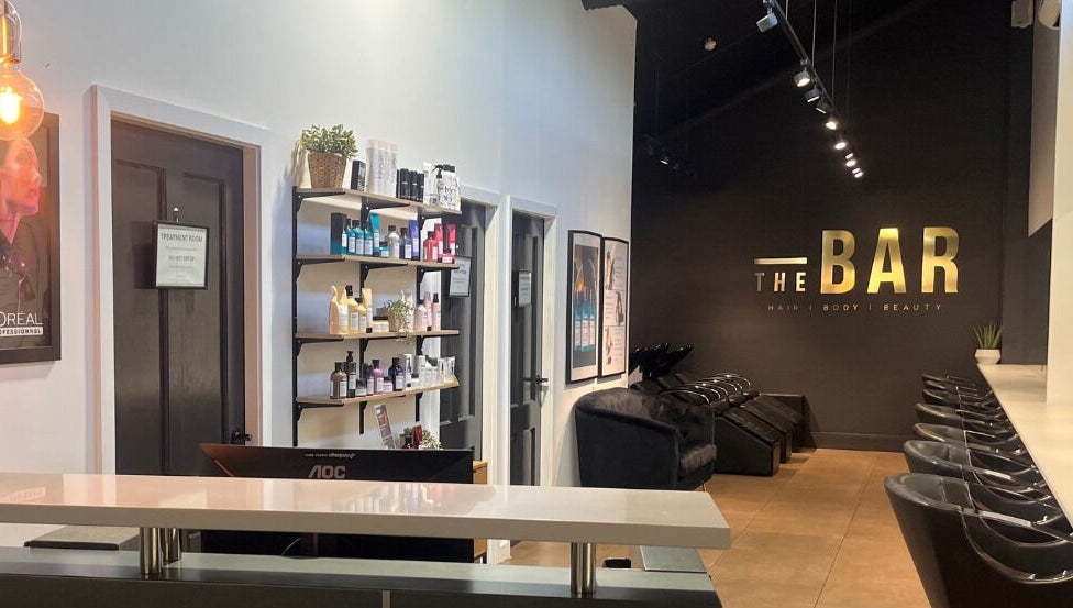 Stylish interior of The Bar / Knockout Hair and Beauty in Penrith, New South Wales, AU with salon chairs and products.