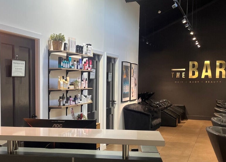 Stylish interior of The Bar / Knockout Hair and Beauty in Penrith, New South Wales, AU with salon chairs and products.