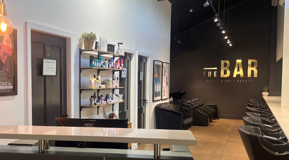Stylish interior of The Bar / Knockout Hair and Beauty in Penrith, New South Wales, AU with salon chairs and products.