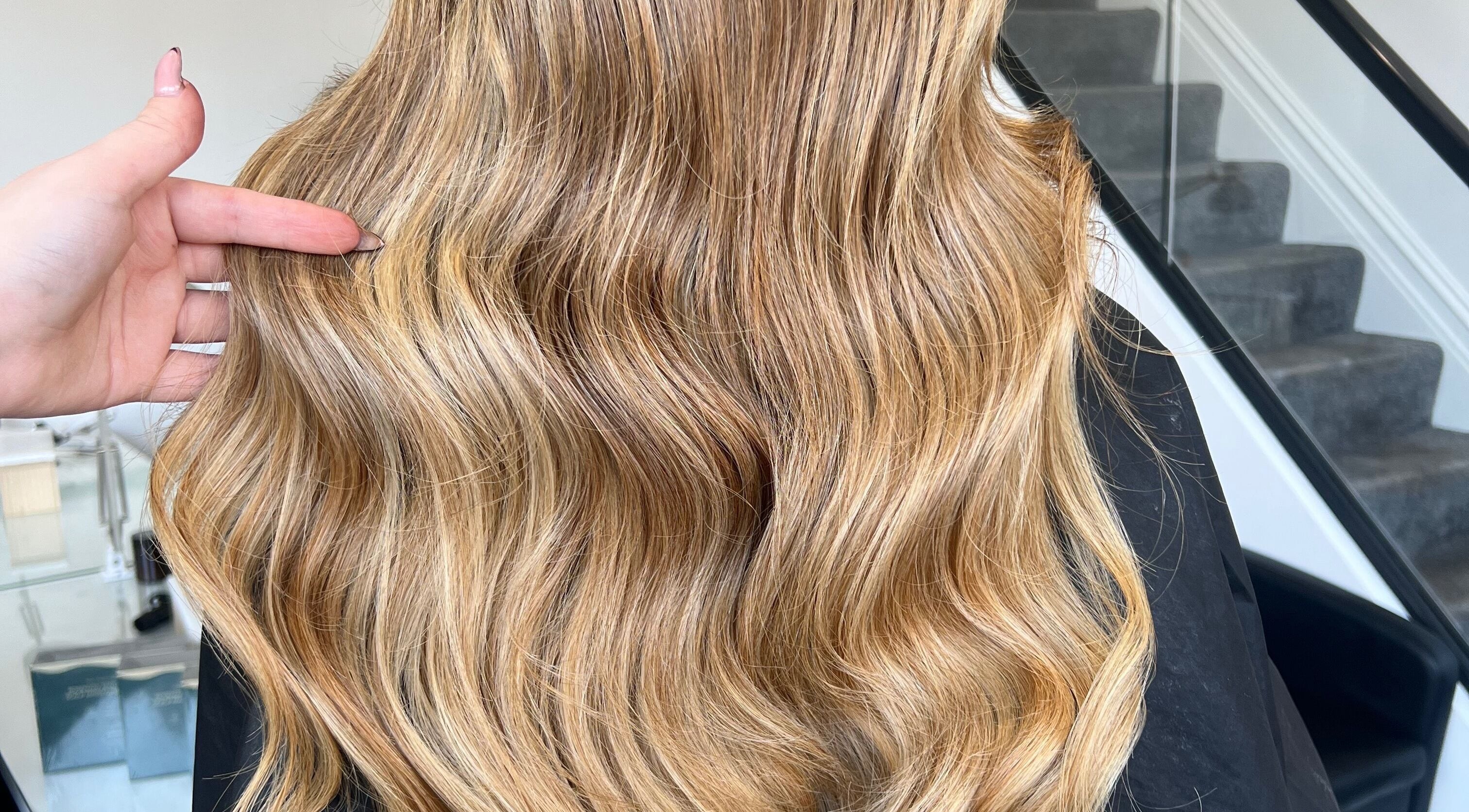 Beautiful wavy blonde hair styled at Hair by Anna Dillon O’Neill, Liverpool, GB.