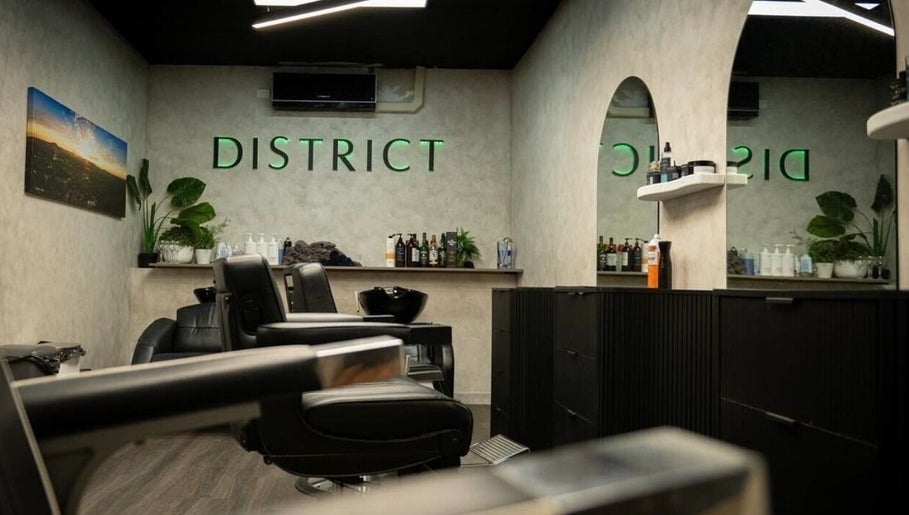 Modern interior of District Barber Studio, Samford Village, Queensland, AU, featuring sleek barber chairs.