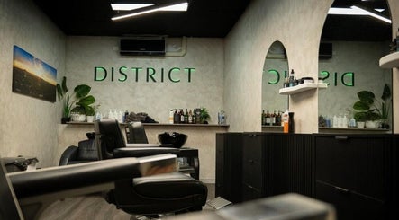 Interior of District Barber Studio in Samford Village, Queensland, AU, featuring stylish seating and modern decor.
