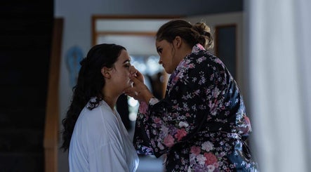 Makeup artist at Alexandra Fabish Makeup Artistry in Christchurch, NZ, perfecting a client's look.