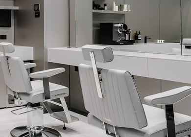 Luxurious white salon chairs in BY FRANCE, Sydney, New South Wales, AU, offering premium beauty services.