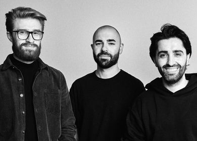 Three professionals at BY FRANCE, Sydney, New South Wales, AU, showcasing a welcoming and stylish atmosphere.