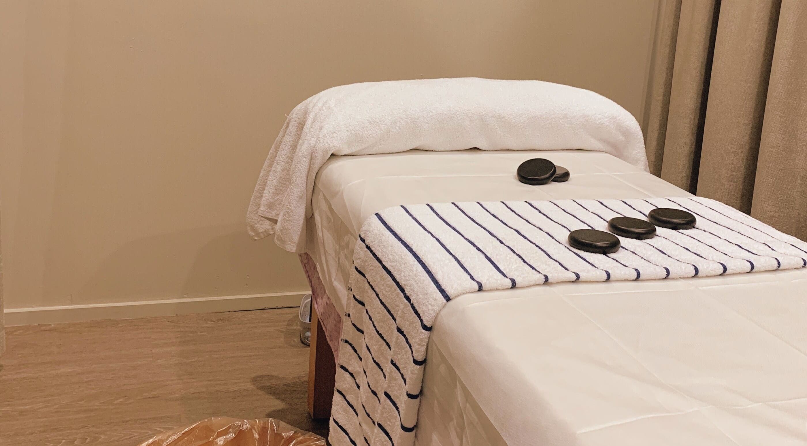 Calming massage table setup at A1 Massage in Joondalup, Western Australia, AU with hot stones and towels.