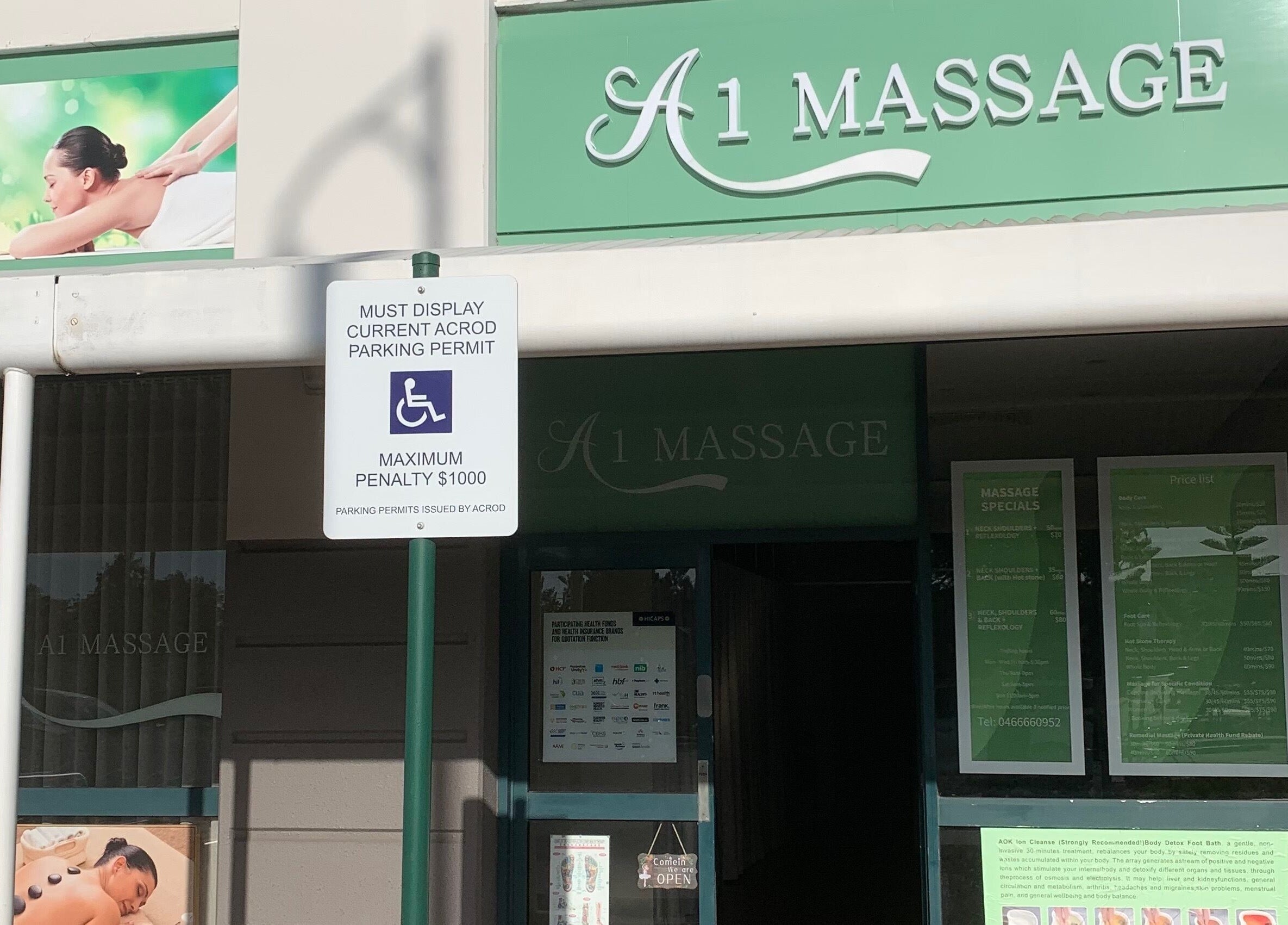 Front of A1 Massage, Joondalup, Western Australia, AU showcasing entry with wellness posters.
