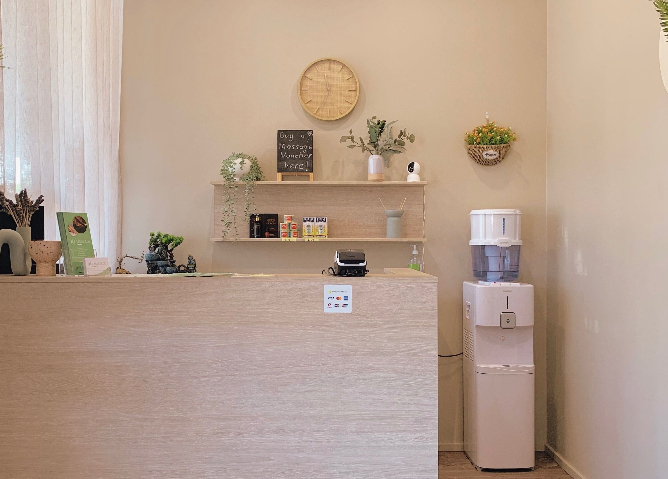 Welcome desk at A1 Massage, Joondalup, Western Australia, AU with decor and wellness items.