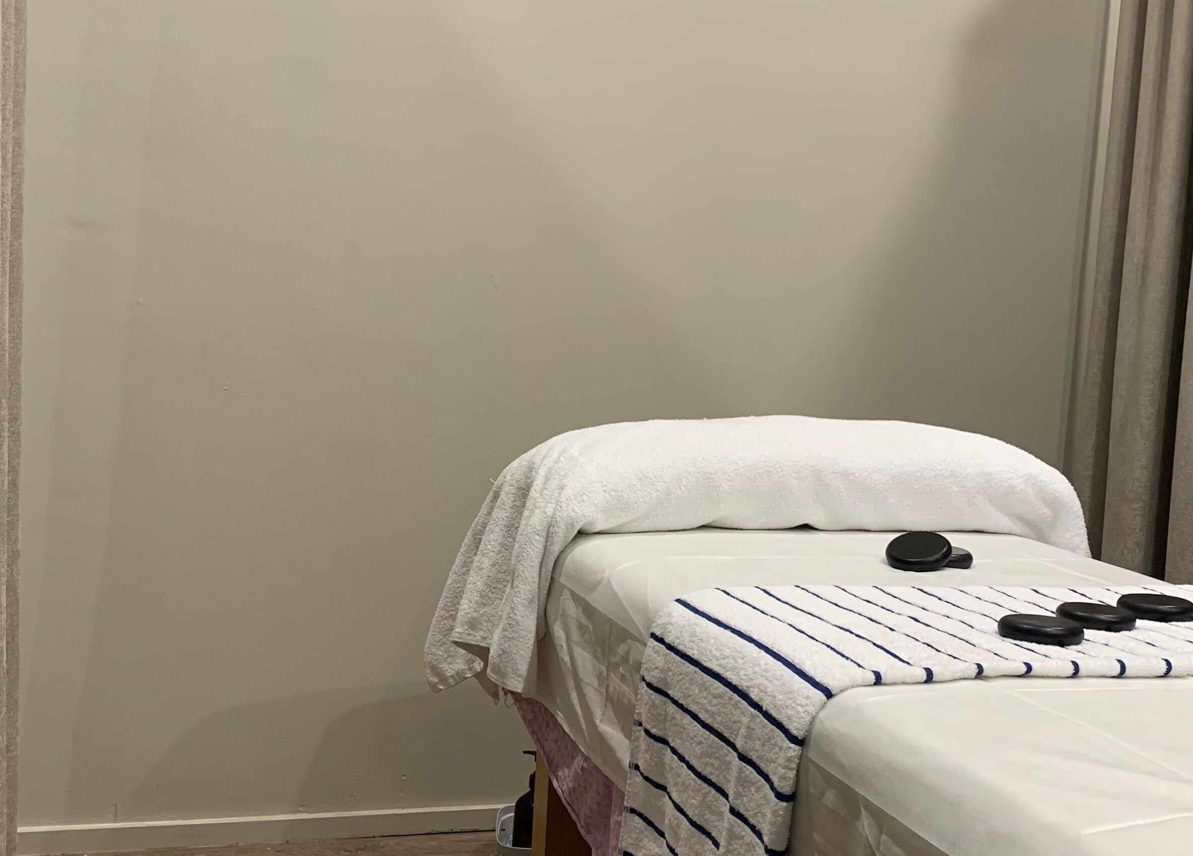 Tranquil massage room at A1 Massage, Joondalup, Western Australia, AU with a prepared massage table and cozy decor.