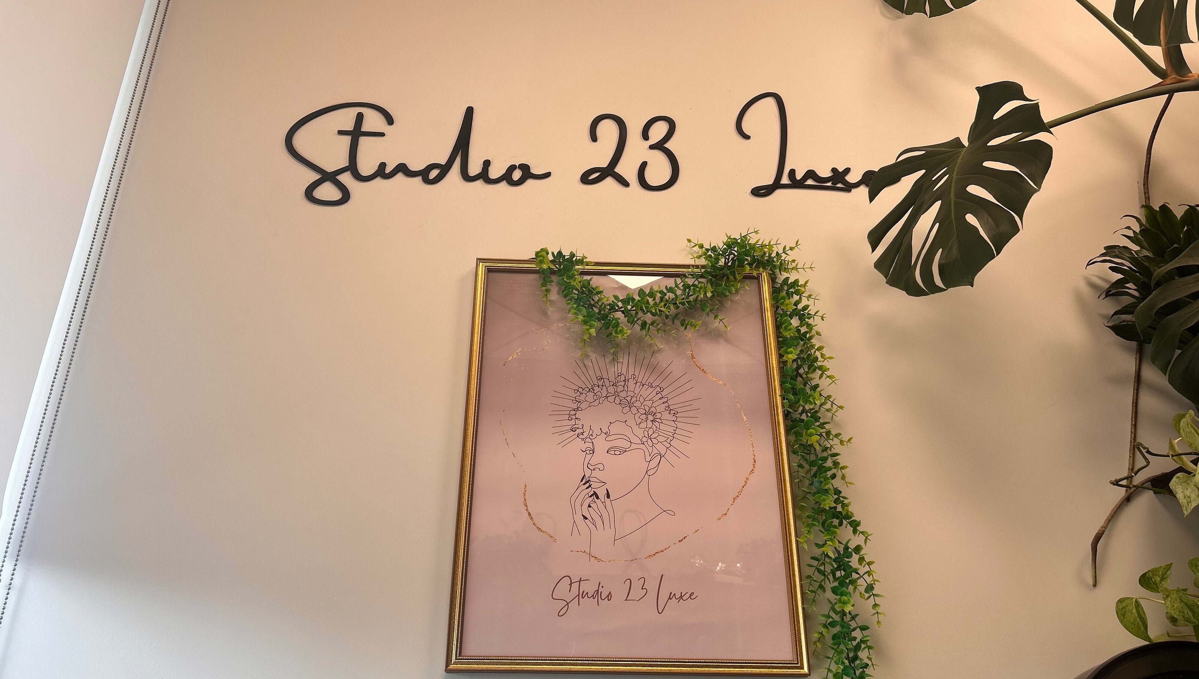 Studio 23 Luxe wall sign and framed art with greenery, Cranbury, New Jersey, US.