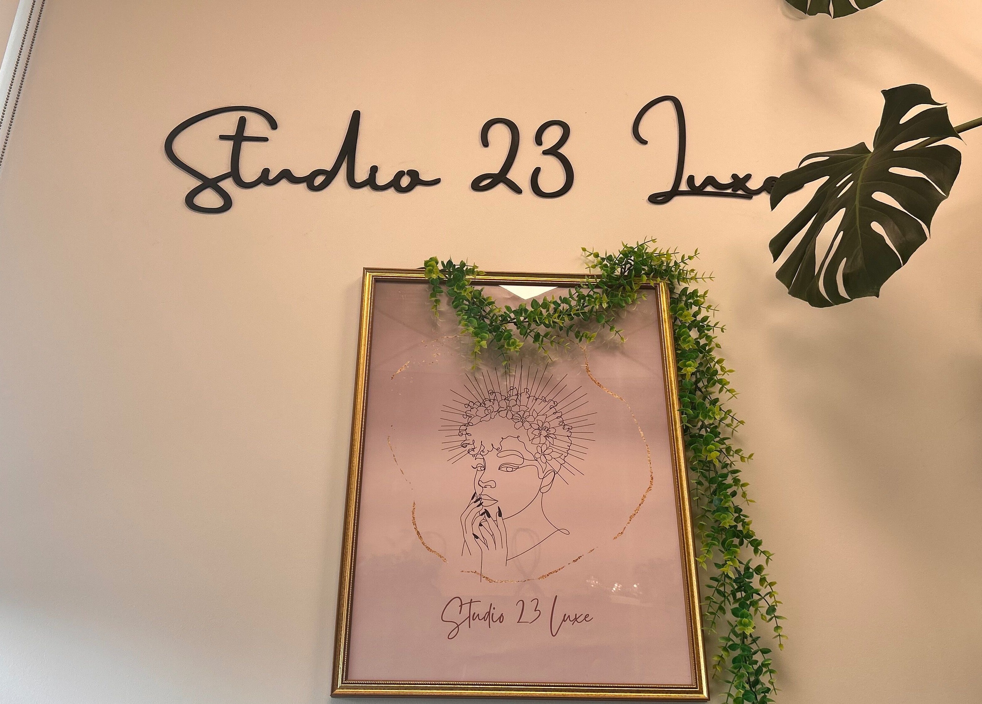Studio 23 Luxe wall sign and framed art with greenery, Cranbury, New Jersey, US.