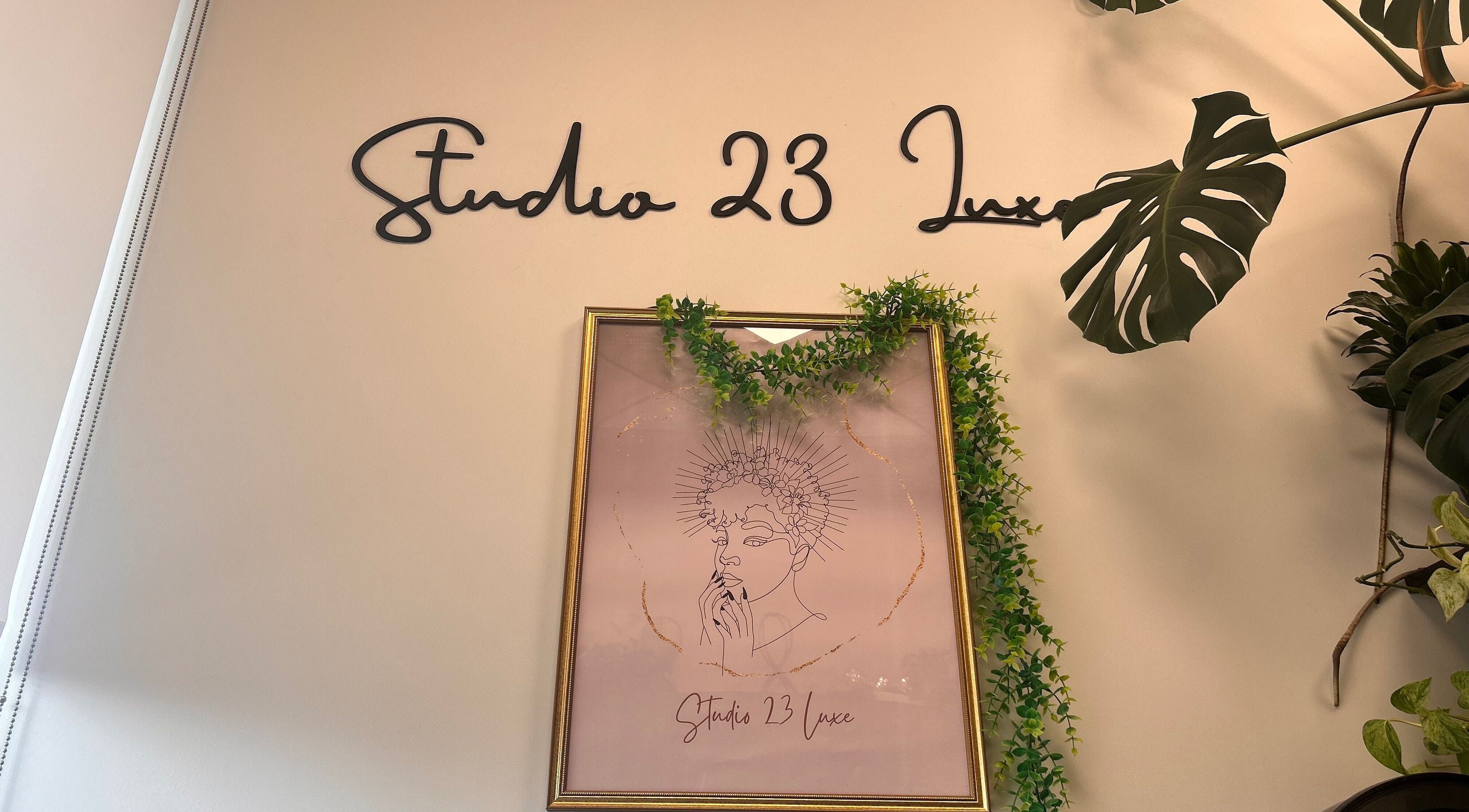 Studio 23 Luxe wall sign and framed art with greenery, Cranbury, New Jersey, US.