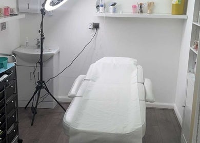 Treatment room at Laesthetics Beauty & More, Catrine, Scotland, GB, featuring a comfortable spa bed.