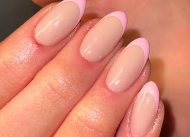 Close-up of elegant pink manicured nails at The Beauty Room, Seaford, England, GB.