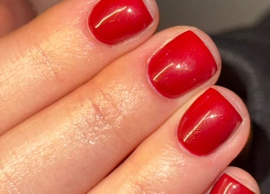 Glamorous red manicure at The Beauty Room, Seaford, England, GB, showcasing perfect nail artistry.