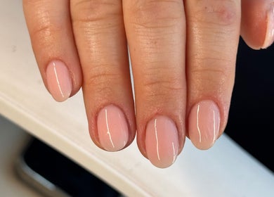 Elegant pink manicure at The Beauty Room, Seaford, England, GB. Perfectly polished nails on display.