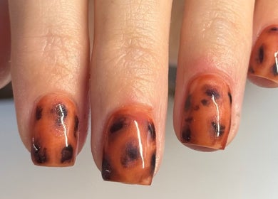 Tiger print nail design at The Beauty Room, Seaford, England, GB.