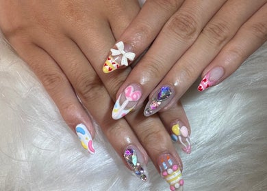 Artistic nail design at JJ Nails Spa by Helen Nham, Whitby, Ontario, CA. Vibrantly decorated fingernails.
