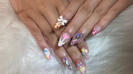 Artistic nail design at JJ Nails Spa by Helen Nham, Whitby, Ontario, CA. Vibrantly decorated fingernails.