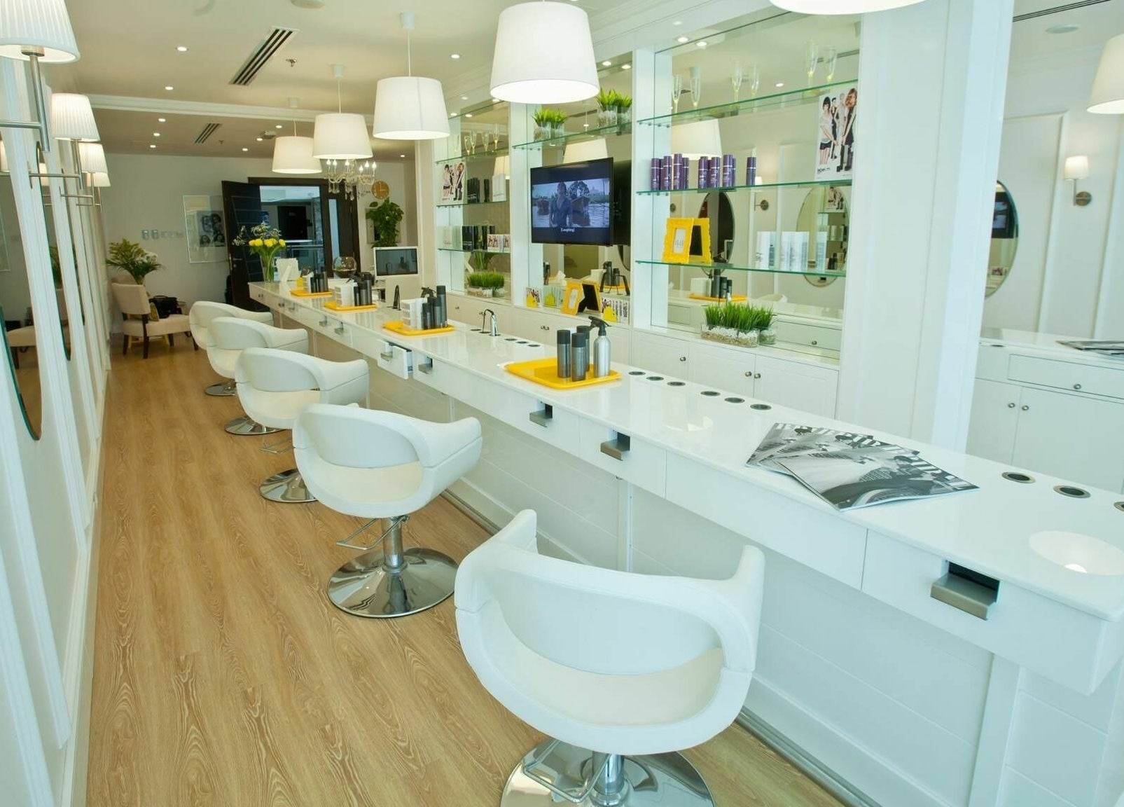Bright interior of Blodry Bar Ladies Salon in Dubai, AE, showcasing modern styling stations and sleek decor.