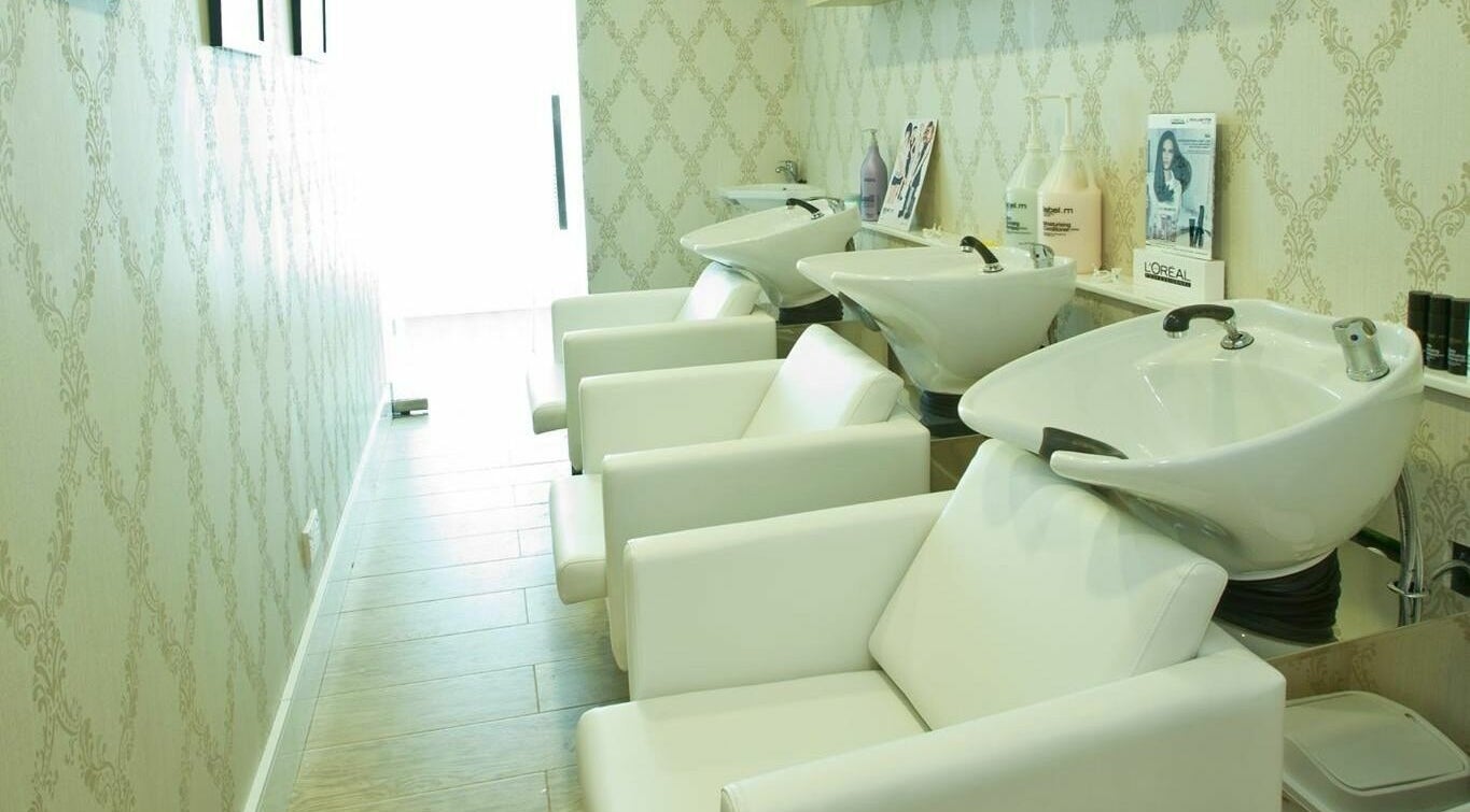 Chic salon wash station at Blodry Bar Ladies Salon, Dubai, AE, offering luxury hair care services.