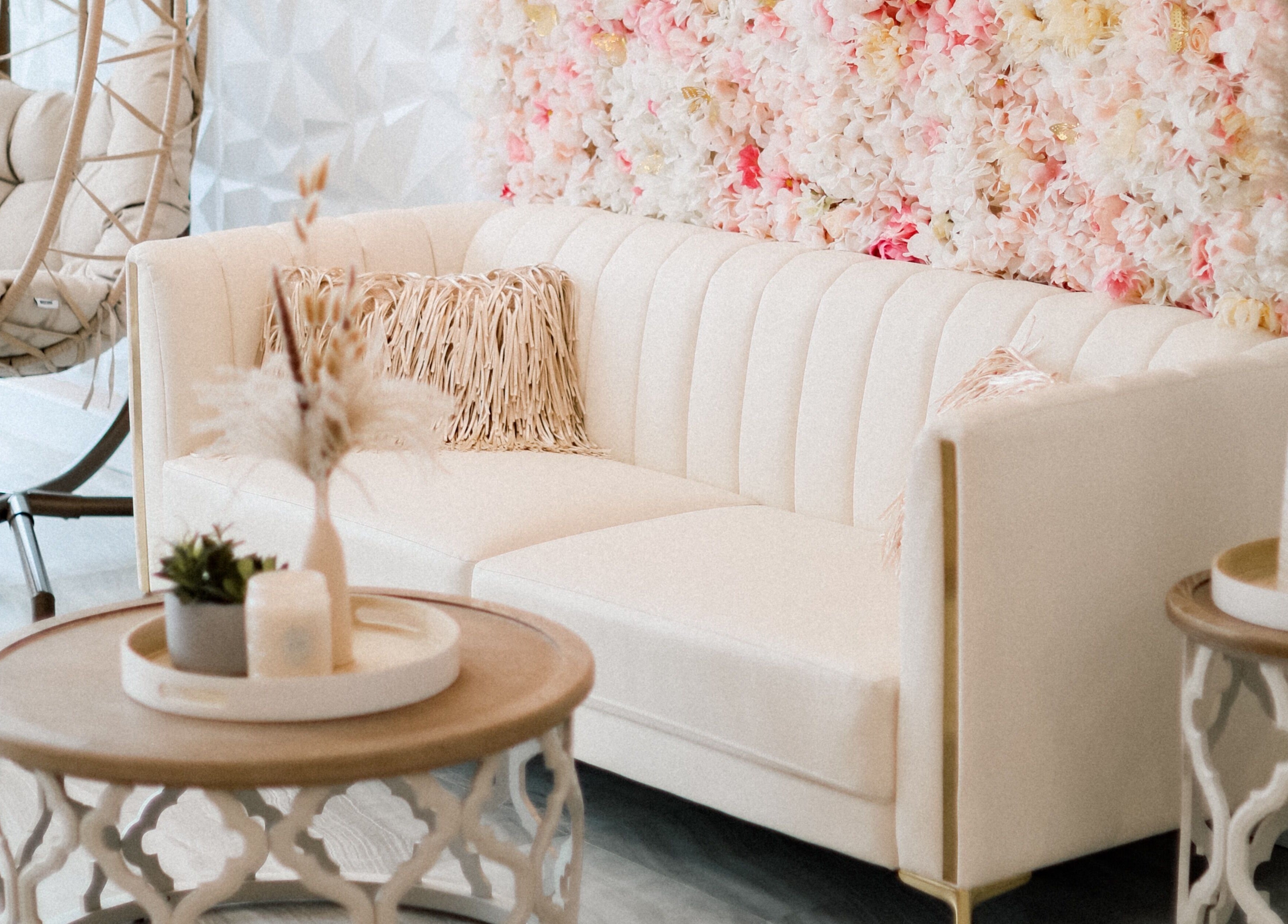 Chic waiting area with floral wall at AvaBellas Brow & Skincare Studio, Bonney Lake, Washington, US.