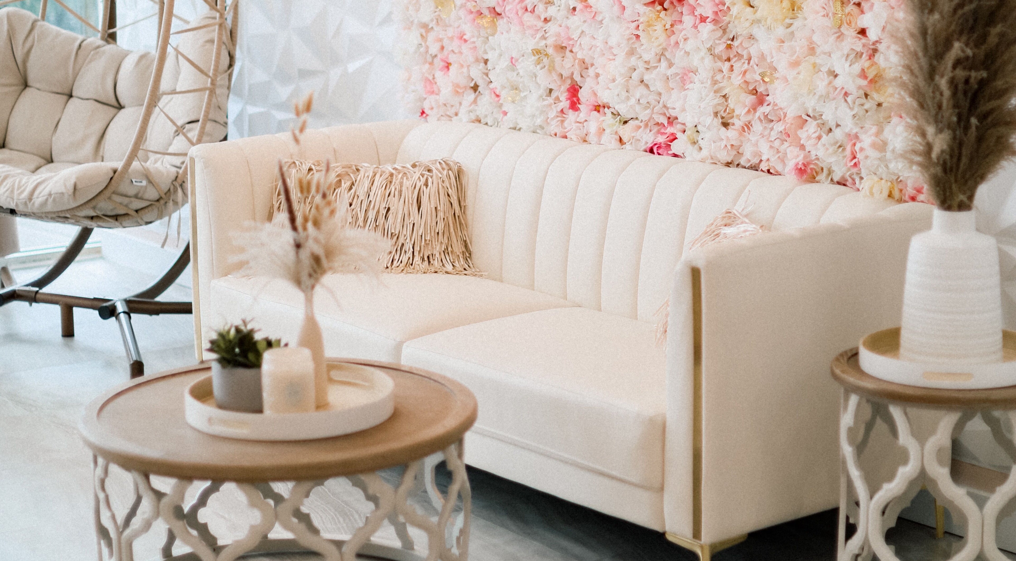 Chic waiting area with floral wall at AvaBellas Brow & Skincare Studio, Bonney Lake, Washington, US.