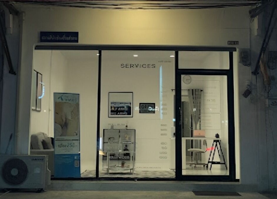 Entrance of Velvet Waxing in Phuket, Phuket, TH, lit warmly with elegant decor visible through glass doors.