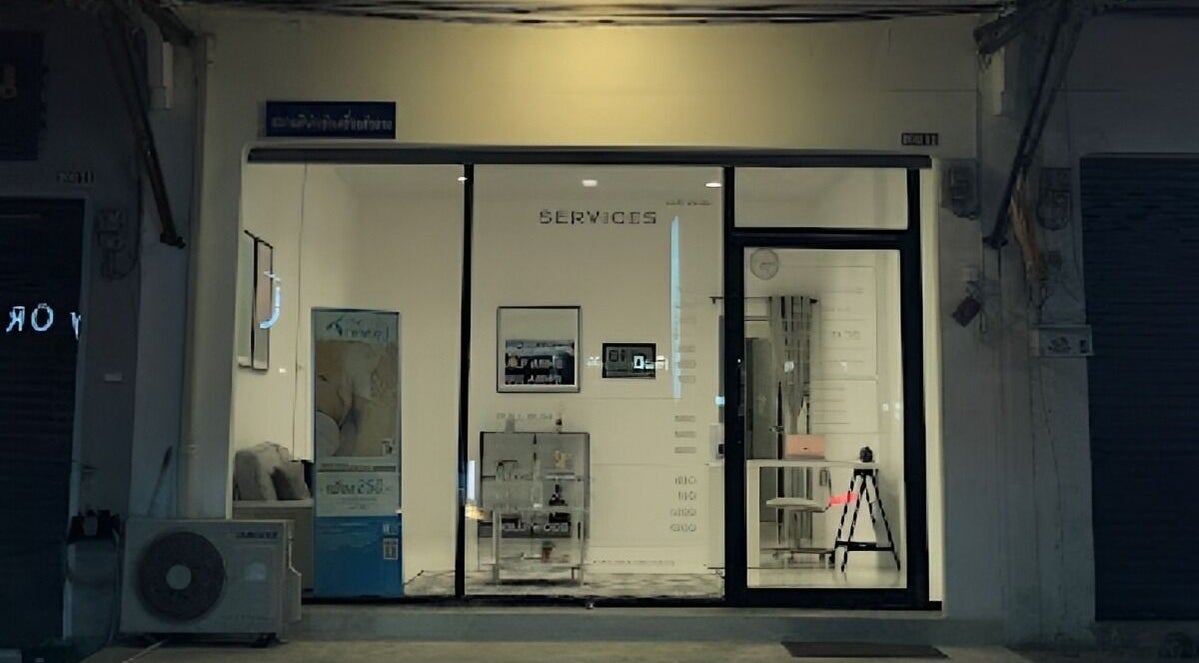 Entrance of Velvet Waxing in Phuket, Phuket, TH, lit warmly with elegant decor visible through glass doors.