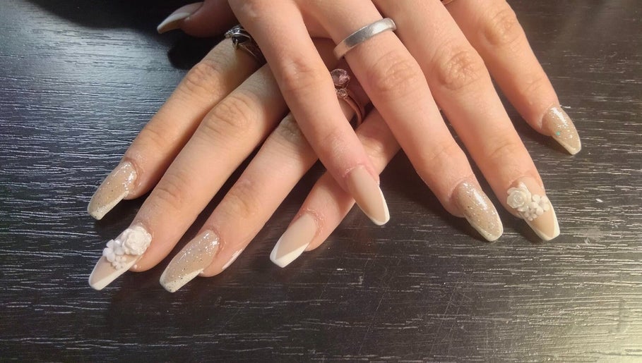 Elegant nail art with floral design at Be*Spelled Nails in Monte Vista, Colorado, US.