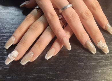 Elegant nail art with floral design at Be*Spelled Nails in Monte Vista, Colorado, US.