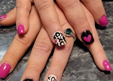 Stylish manicured nails with unique designs at Be*Spelled Nails, Monte Vista, Colorado, US.