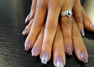Beautiful purple and glitter nails at Be*Spelled Nails, Monte Vista, Colorado, US.