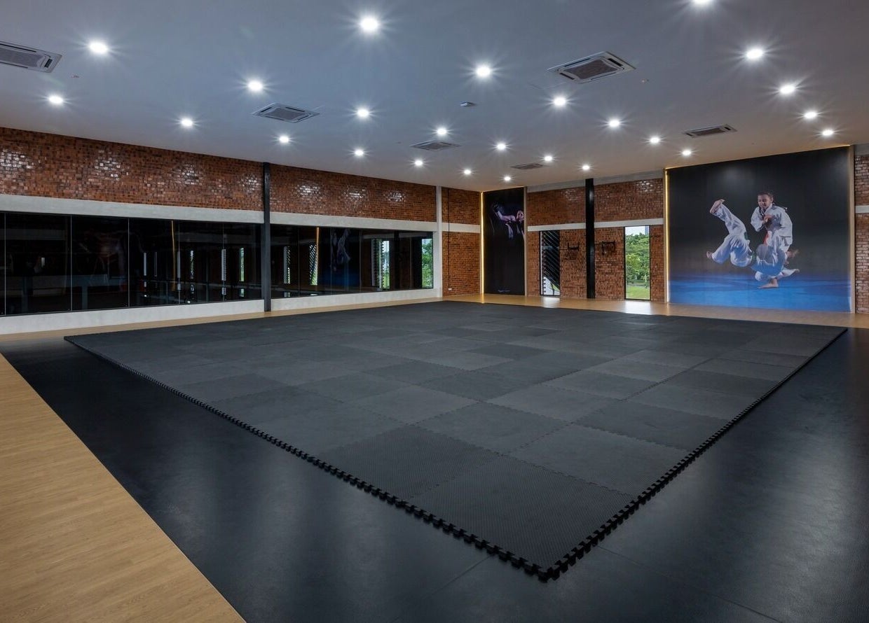 Spacious martial arts studio at Estuari Sports Complex, Iskandar Puteri, Johor, MY, with sleek padded flooring.