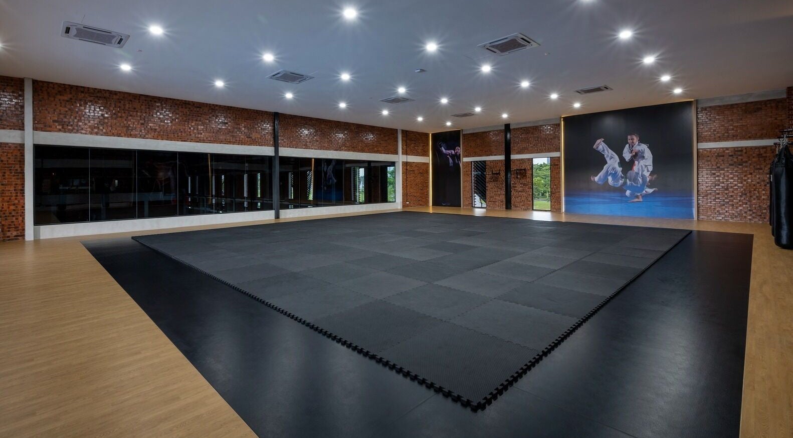 Spacious martial arts studio at Estuari Sports Complex, Iskandar Puteri, Johor, MY, with sleek padded flooring.